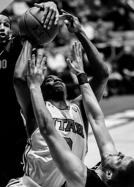 Utah's Anthony Odunsi is fouled by Colorado's Austin Dufault, right. University of Utah vs. Colorado, college basketball at the Huntsman center Saturday, February 18, 2012 in Salt Lake City, Utah. by Trent Nelson/The Salt Lake Tribune