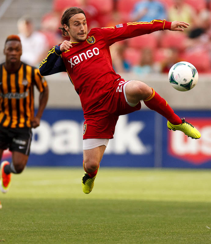 Real Salt Lake's Ned Grabavoy leaps for the ball as Real Salt Lake hosts Charleston Battery in the US Open Cup Wednesday June 12, 2013 at Rio Tinto Stadium in Sandy, Utah